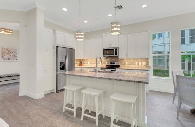Isles of Collier | 3 bedrooms | 3 bathrooms | a den/office | sunroom | 2-car garage.