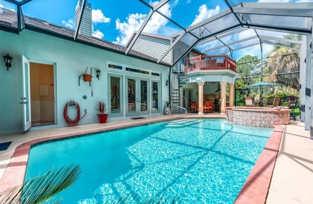 Just miles to Naples beaches a pool, hot tub, giant firepit and outdoor kitchen.