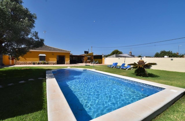 La Casita, rustic has a large garden with swimming pool.