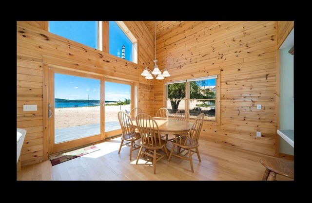 Lake frontage, Dune beach sand from deck to water! One of a kind.