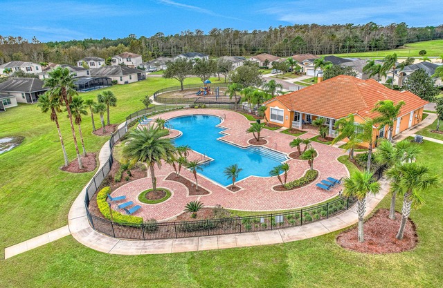Lake-view home with screened pool & private lanai + clubhouse pool & playground