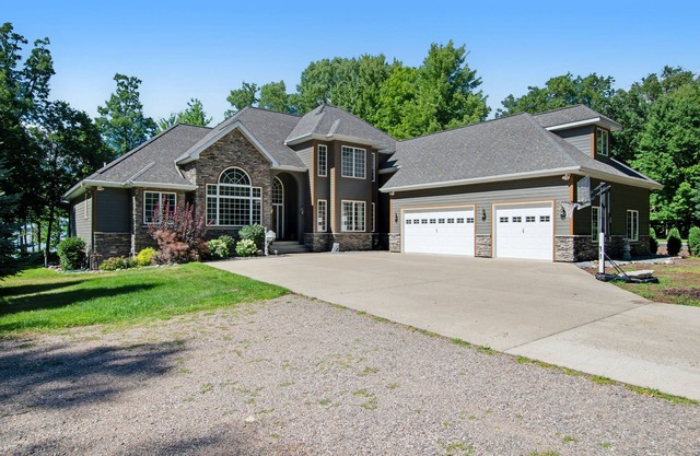 Lakefront estate with firepit, grill, game room & sauna - near Sand Valley Golf