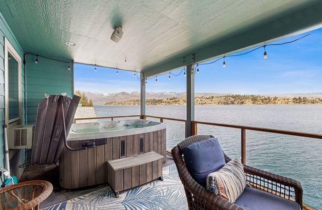 Lakefront home with private hot tub, dock, kayaks, covered veranda & huge views