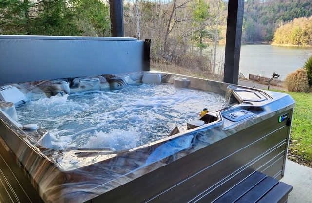 Lakefront Lullaby-Rustic cabin w/lake views, boatslip, hot tub & fiber internet