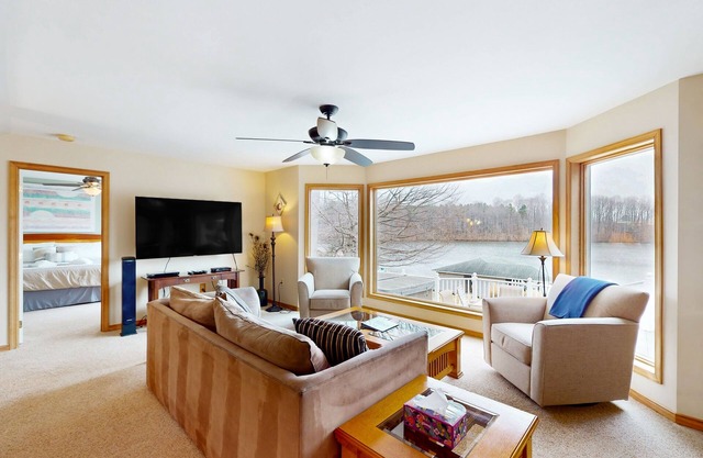 Lakefront retreat with views, hot tub, kid's play area, dock & fiber internet