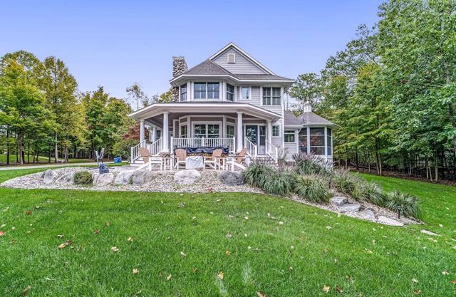 Lakeview home with beach access, private pickleball court, firepits & fireplace