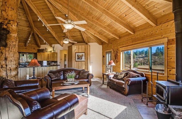 Large family-friendly cabin with game room, hot tub, & wraparound deck