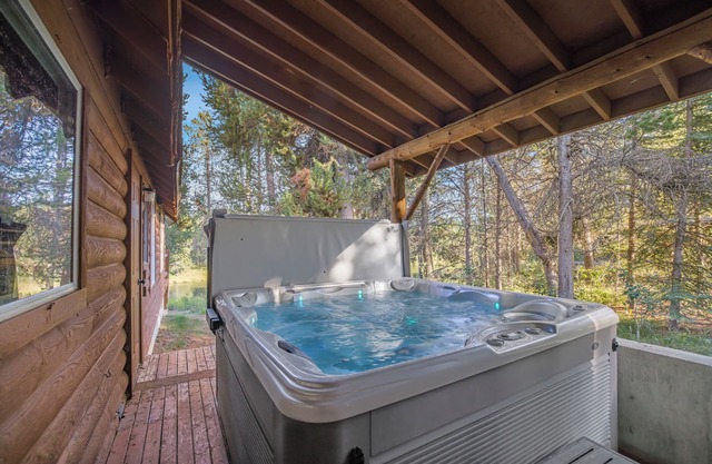 Large Riverfront Cabin with Hot Tub, Arcade Games, & Luxury