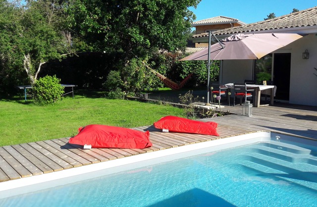 Listed modern house with heated pool between pond and ocean