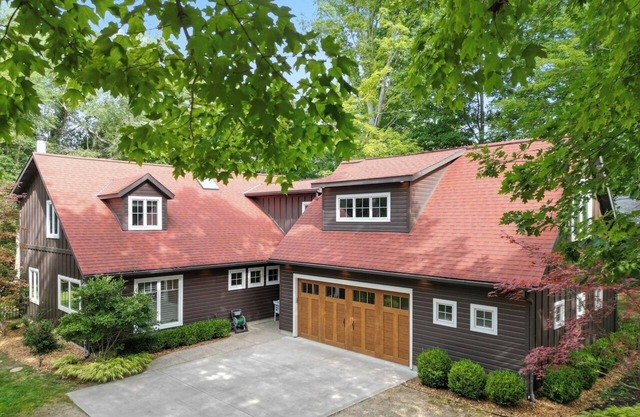 Listen to the waves in this charming, two-story home is nestled away on quiet &