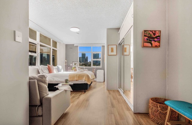 Location and lifestyle in a cute luxe studio with stunning city views