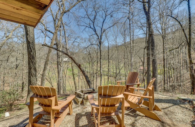 Log home in private neighborhood with covered porch & fireplace