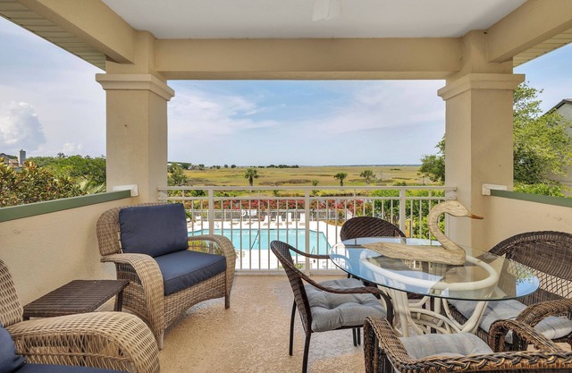 Long distance marsh views and community pool.