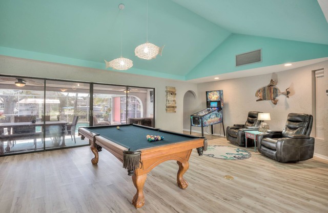Lovely Canal Home in SW Cape with heated pool, game room, and a tiki on the dock