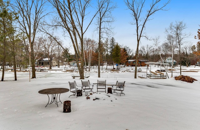 Lovely lakefront home with a game room, firepit, dock & W/D - private beach area