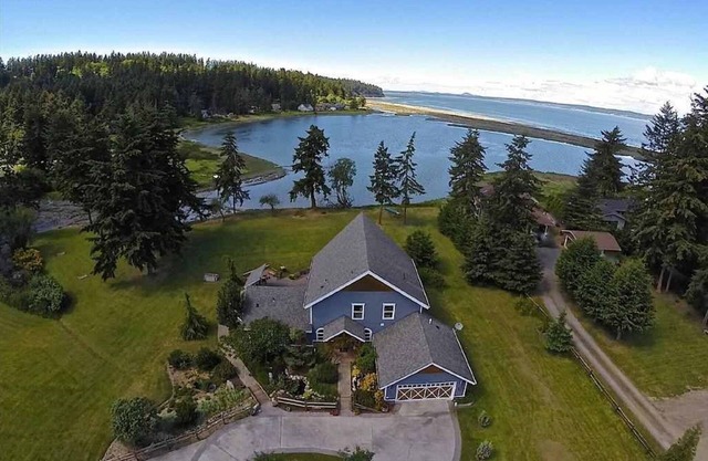 Luxury Lodge Style Custom Home on Private Oceanfront Lagoon Acreage.