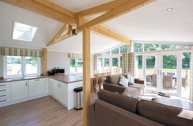 Luxury lodge with one double with en suite shower and two twin.