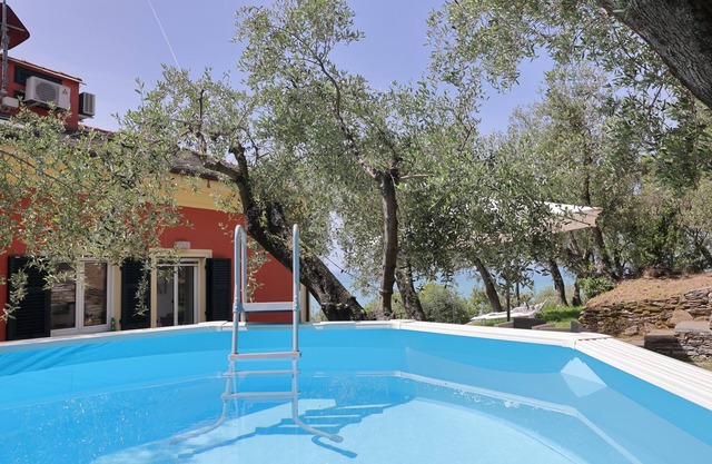 Maiso house nestled between the sea and olive trees