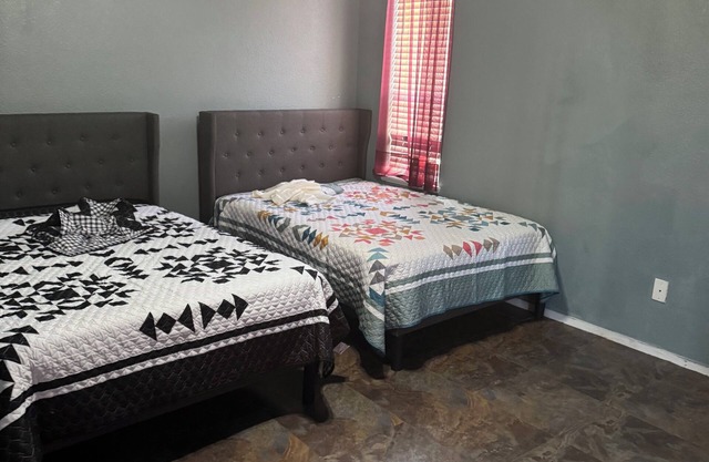Master bedroom with private restroom and private entrance. Two full beds+ futon