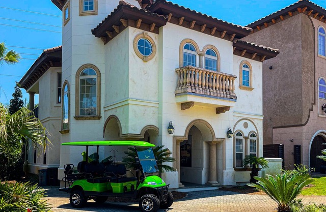 Mediterranean-style home with pool & hot tub access, W/D, AC & golf cart
