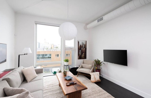 Modern 1BR Apt with Skywalk to Fiserv, Rooftop, and Parking