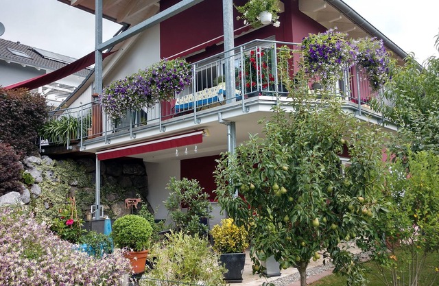 Modern holiday apartment with a large, partially covered terrace
