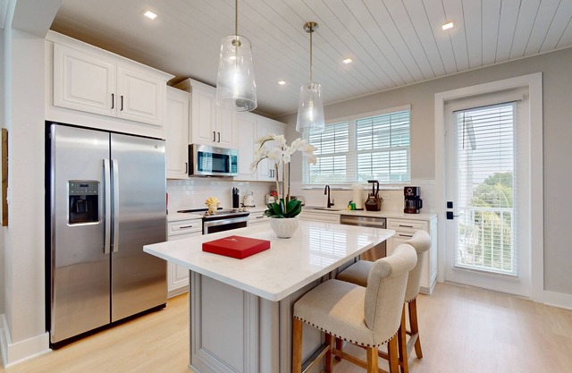 Modern home with screened-in balcony, pool, bikes, & EV charger - great location