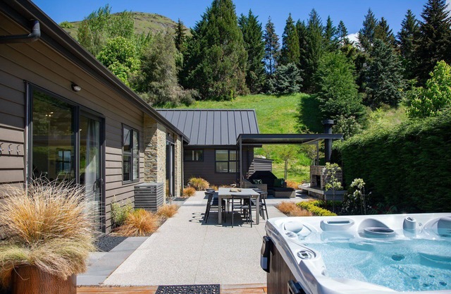 Modern luxury with spa pool, outdoor fireplace, table tennis and darts