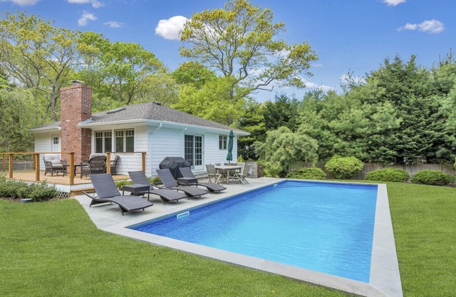 Modern-style home with private pool, open-floor living plan, back porch,.