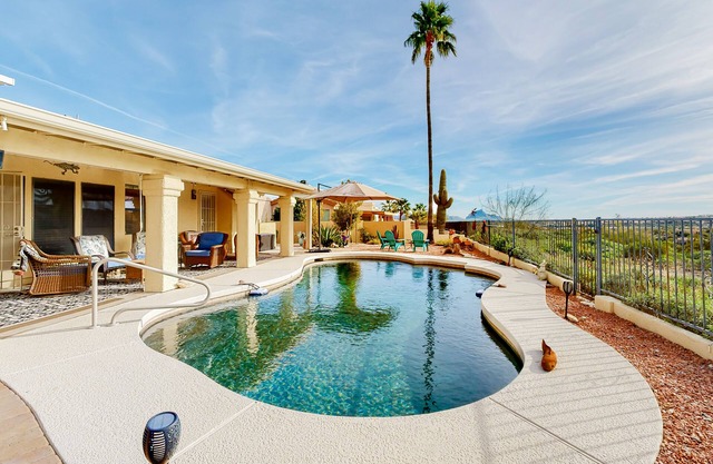 Mountain-view home with pool, furnished patio, washer/dryer & central AC
