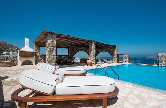 Natural Stone Villa has amazing view in town and aegean private pool free park