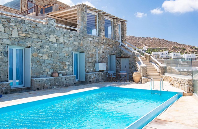 Natural Stone Villa has amazing view in town and aegean private pool free park