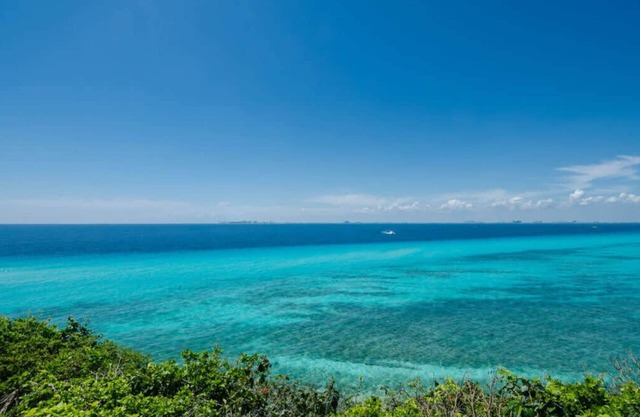 Nautibeach Condo 4 offers patio living, pool and beach access