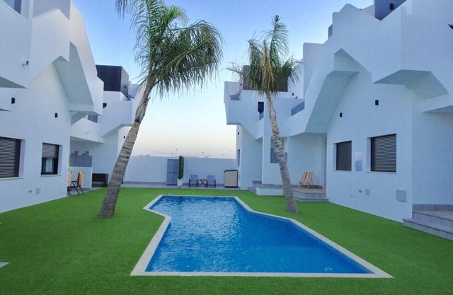 New apartment with large roof terrace and swimming pool, near the sea and beach