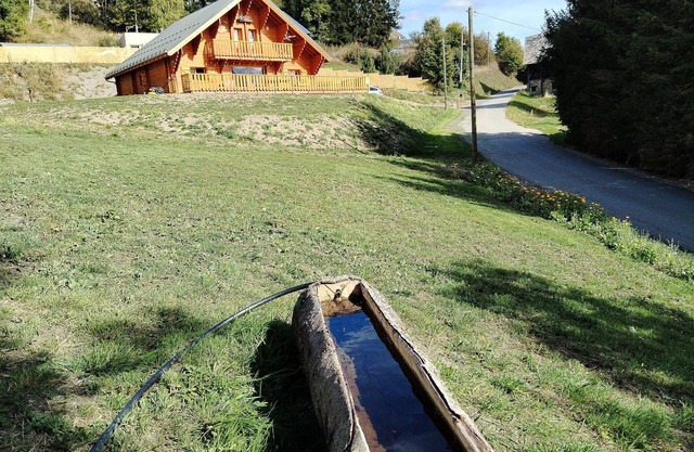 New traditional chalet in a mountain village in the Alps.