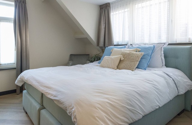 Newly renovated 1920 building with large hotel bed, patio and shared kitchen.