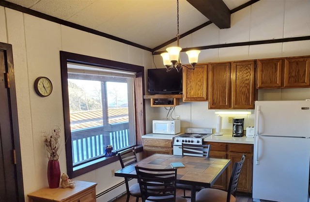 Nicely decorated and convenient - on the upper parking lot level with great views.