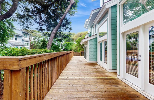 Ocean view home with shared pool and direct beach access, close to town