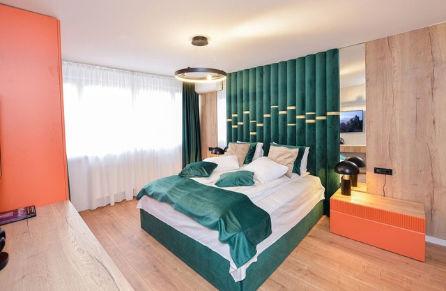 One bedroom with king size bed, living room with sofa bed, equipped kitchen,