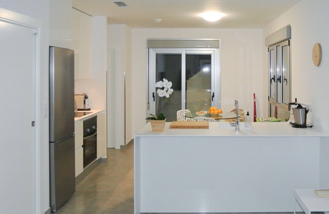 Penthouse with large roof terrace, sea view and pool