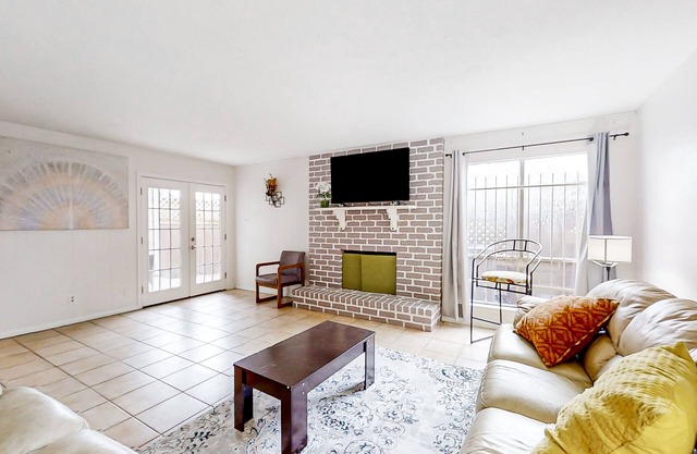 Perfectly situated townhome with step-free access, W/D, central air, & patio