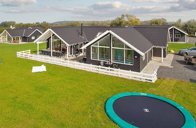 Pool house on lawn with whirlpool, billiards, table tennis and table football, wireless internet