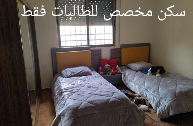 private bedroom in a shared flat with a family for females only