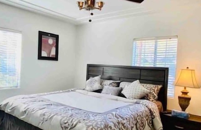 Private bedroom with shared full bathroom, shared living room, kitchen, laundry
