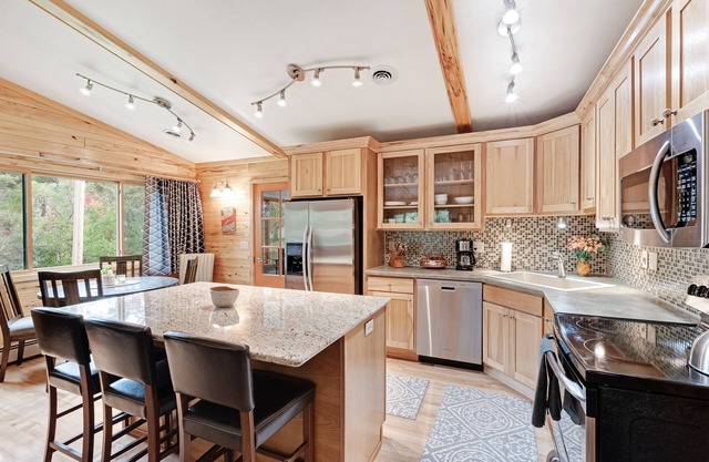 Private lakefront home with boat dock, fireplace, & generous yard