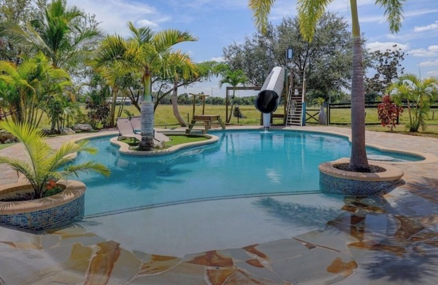 Private Tropical Oasis 4/2 Home with Resort Style Pool & Waterslide