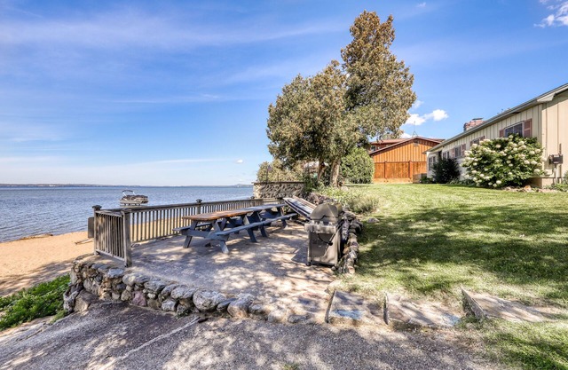 Quaint lakefront home with large yard & sandy shores - only minutes to town