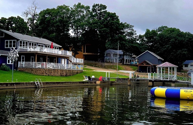 Relax by Lake of the Ozarks in your spacious Sunrise Beach retreat on 1 acre.