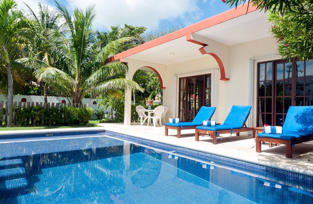 Relax by the sparkling pool and enjoy the ocean breeze.