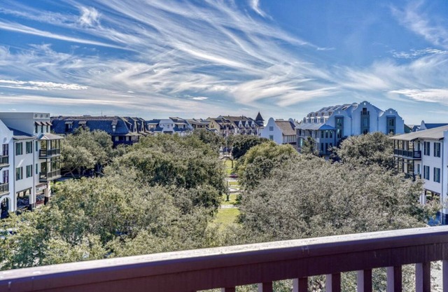 Relax in the heart of Rosemary in this elegant condo overlooking the town square